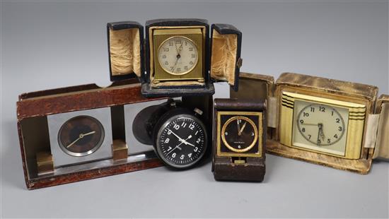 Cased Zenith timepiece, two cased Art Deco timepieces, a Doxa 8-day folding clock and a Smiths stopwatch/clock.